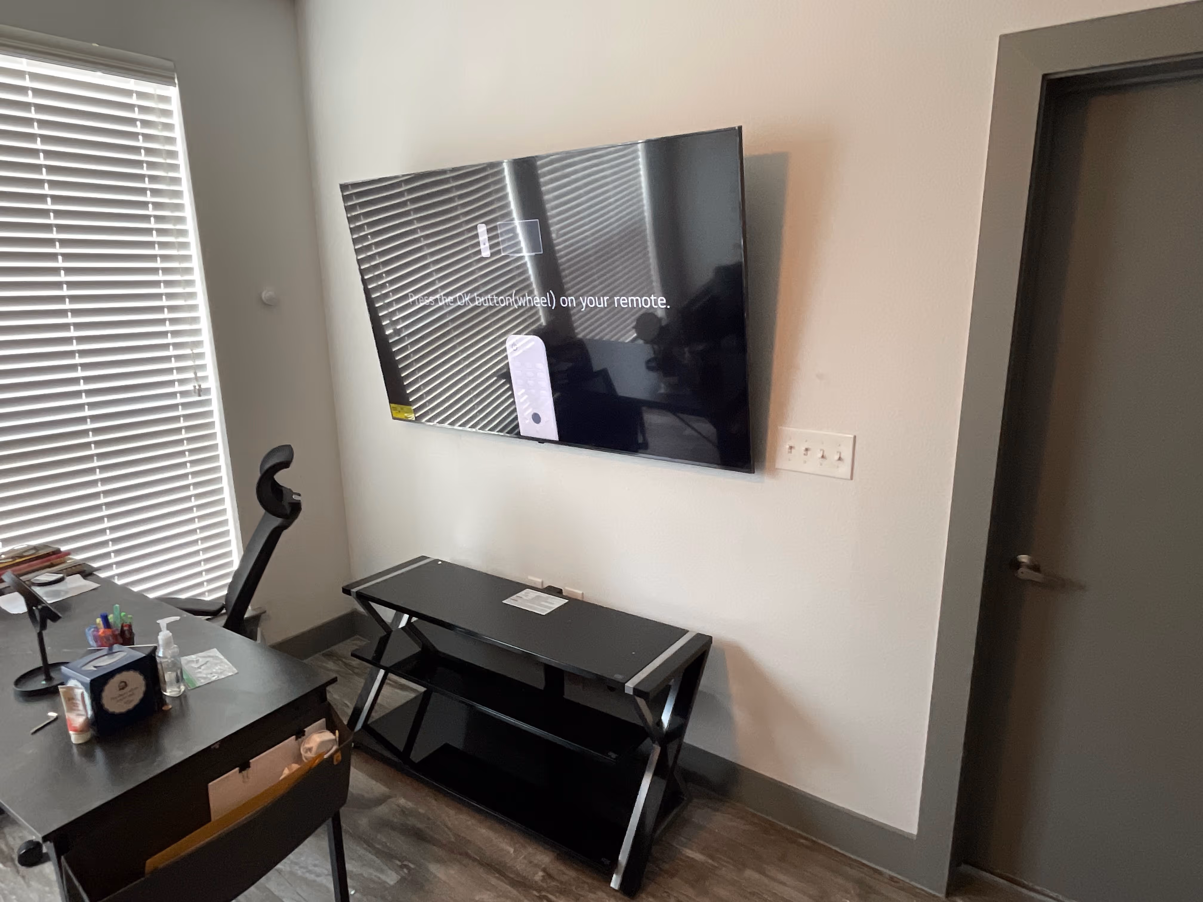 Large television mounted by A-Breasy